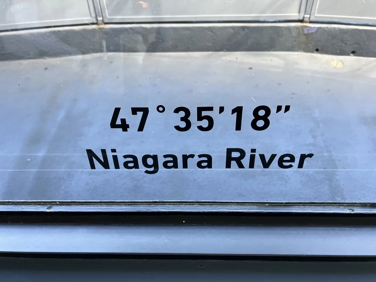 Brass direction marker on the Skylon deck: 47 degrees 35 minutes 18 seconds, Niagara River