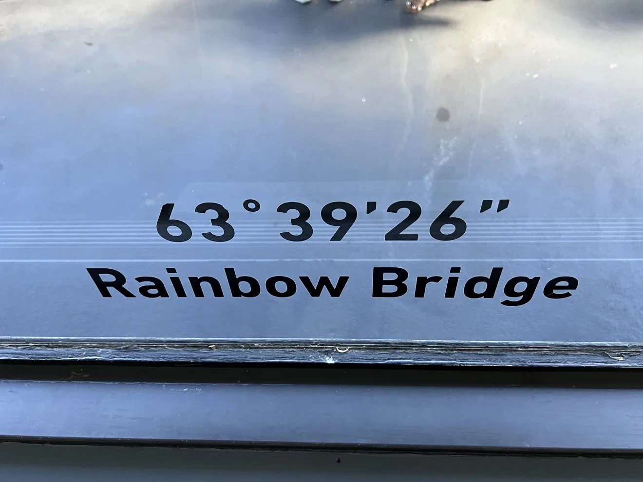 Brass direction marker on the Skylon deck: 63 degrees 39 minutes 26 seconds, Rainbow Bridge