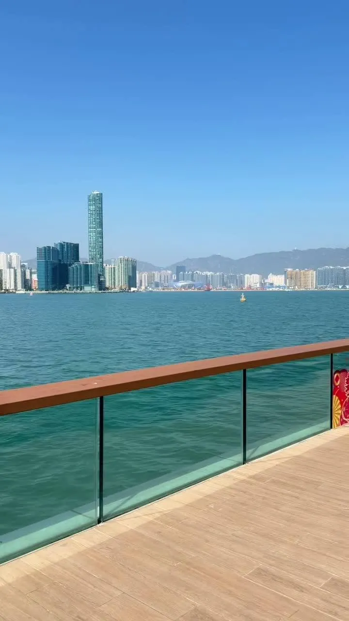 Waterfront promenade facing the Victoria Harbour skyline