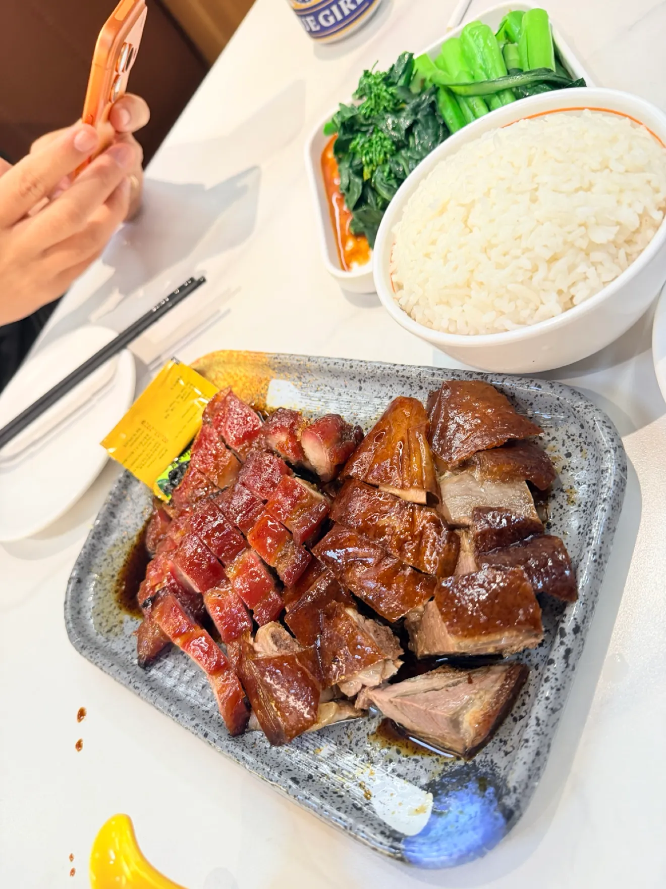 A mixed roast platter with greens and rice