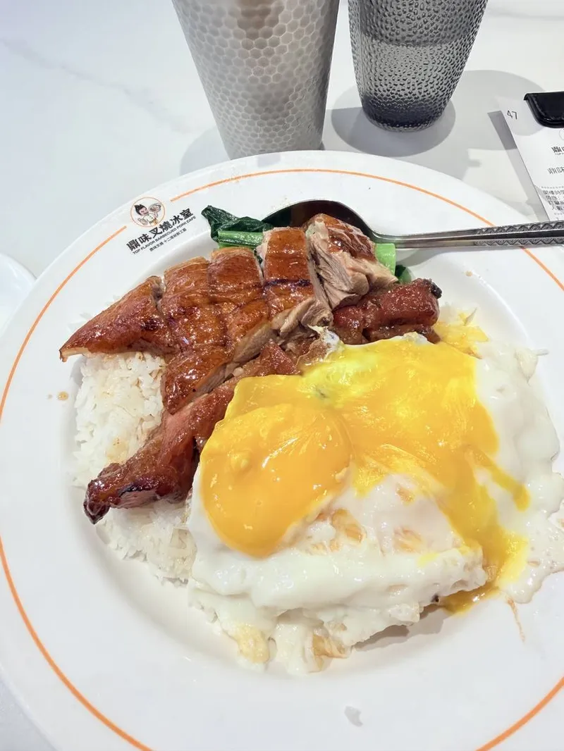 Char siu and roast-duck rice with soft-yolk eggs