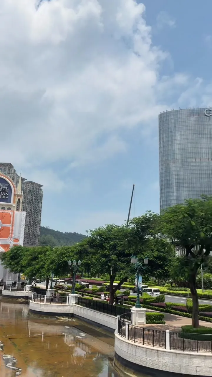 Outdoor water feature and hotel buildings along Cotai