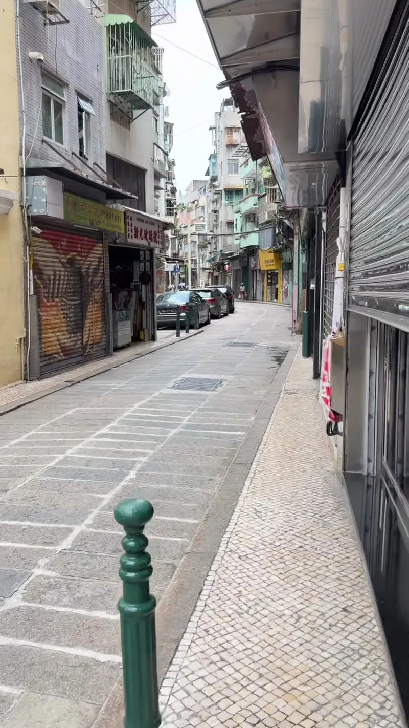 A quiet Macau old-town street with few visitors